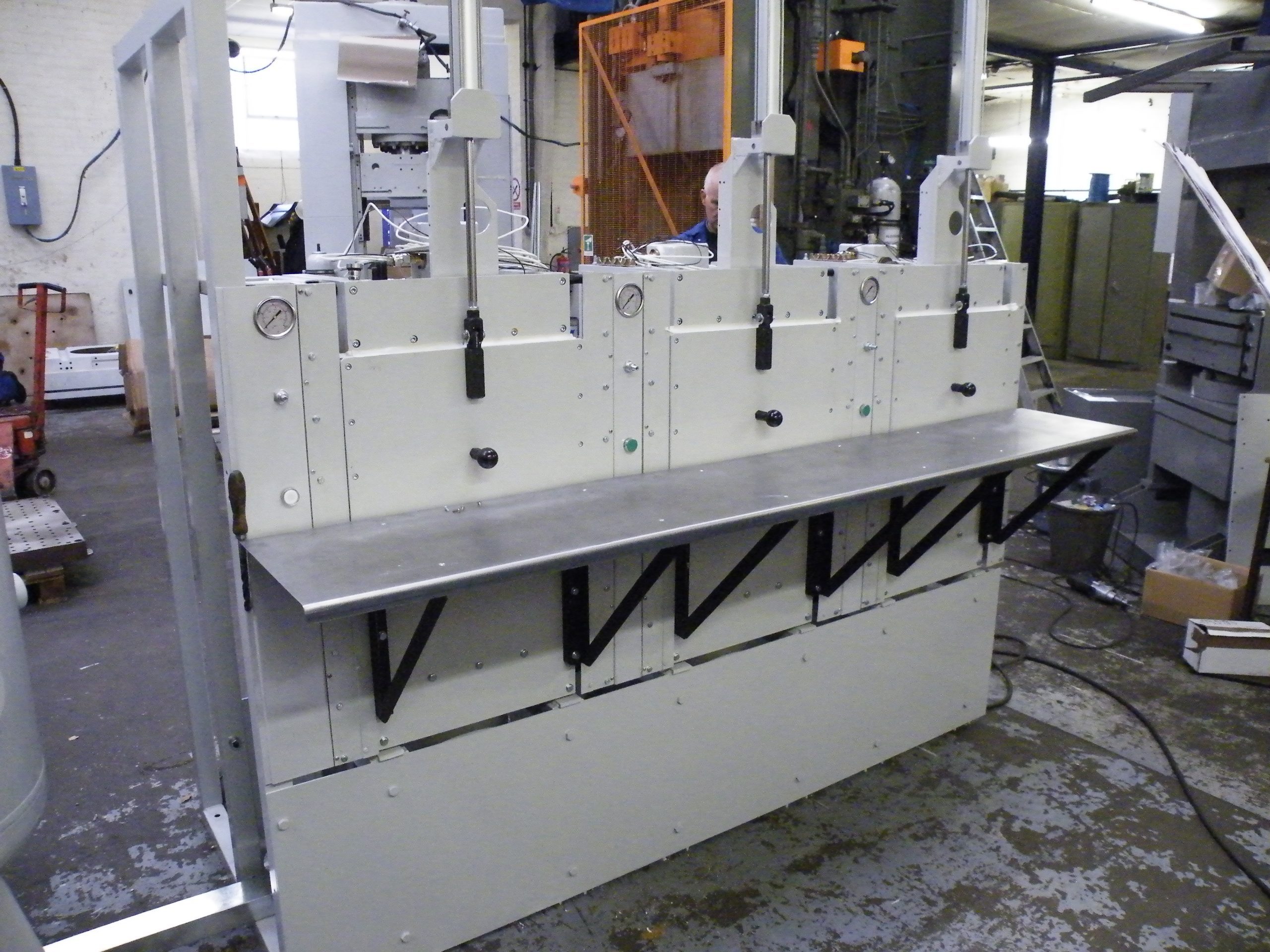 Bank of three cmpression presses for moulding O-Ring seal